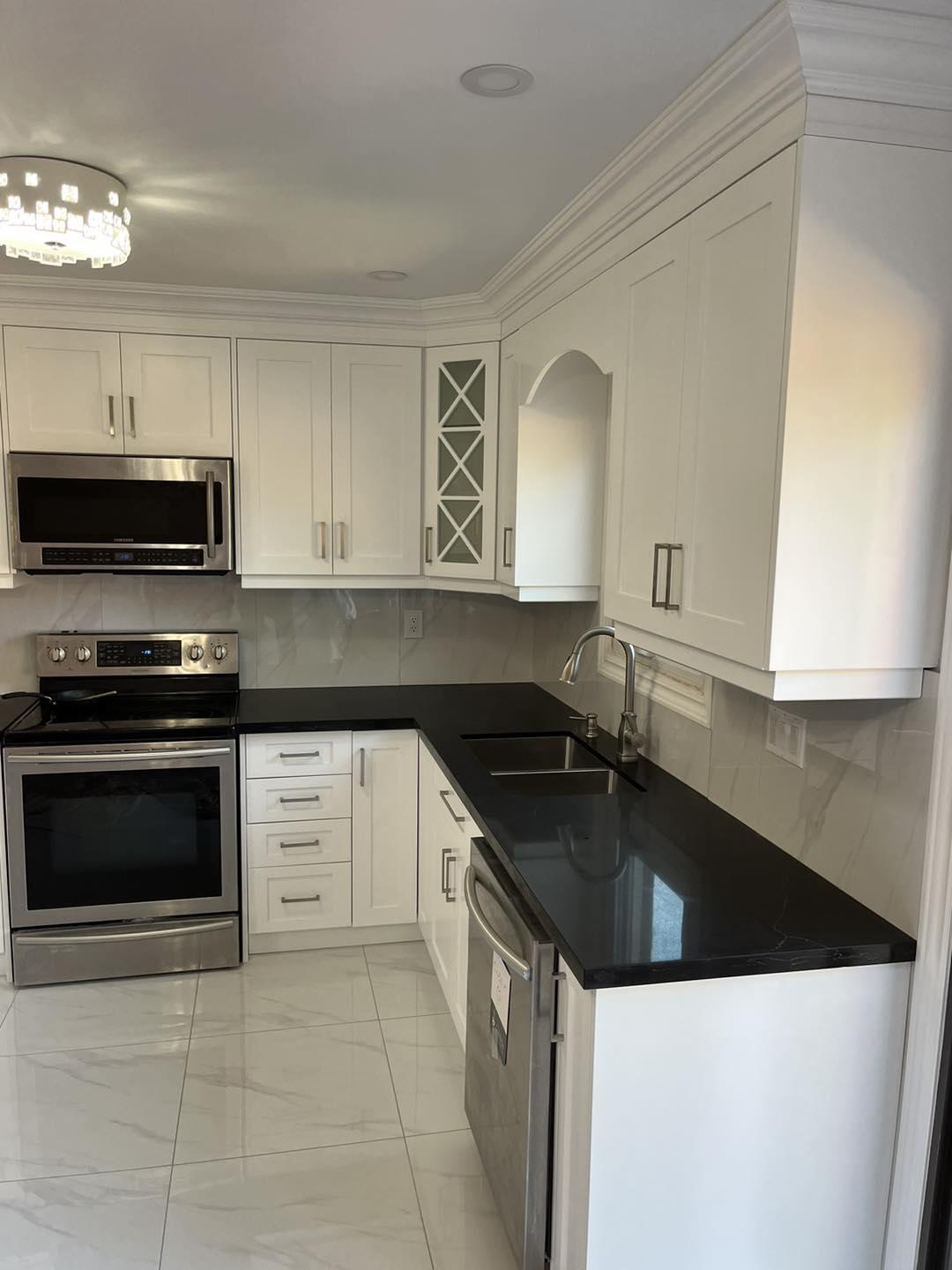 Classic White Kitchen with Black Granite — image 1